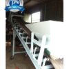 Băng tải lòng máng xoay hướng